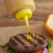 a yellow plastic bottle with a yellow cap