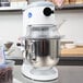 A Globe countertop mixer with a bowl of chocolate chips.