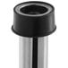 A close-up of a silver metal Regency overflow pipe with a round black object on one end.