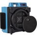 An XPOWER X-4700A air scrubber with a black cover and blue and black machine.