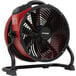 An XPOWER red and black industrial axial fan on a stand.