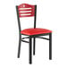 A Lancaster Table & Seating black and mahogany side chair with red vinyl seat.