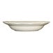 A white stoneware pasta bowl with a scalloped edge.