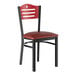 A black Lancaster Table & Seating side chair with a red vinyl seat.