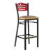 A Lancaster Table & Seating mahogany and black restaurant bar stool with a light brown cushioned seat.