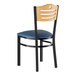 A Lancaster Table & Seating wooden side chair with a navy blue cushion and black frame.