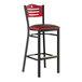 A Lancaster Table & Seating bar stool with a red vinyl seat and mahogany back.