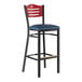 A Lancaster Table & Seating mahogany wood bar stool with a navy blue cushion on the seat.