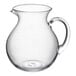 An Acopa clear glass pitcher with a handle.