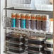 A 3" Large Cooler Door Merchandiser in an organic food store filled with food and drink containers.