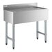 A stainless steel underbar drainboard with a raised backsplash and sturdy legs, measuring 36 inches by 18 inches.