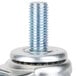 A close-up of the metal nut on a threaded bolt.