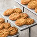 A tray of Rich's Jacqueline preformed peanut butter cookies on a table.