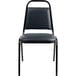 A black National Public Seating stackable chair with midnight blue vinyl upholstery and a metal frame.