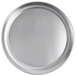 A close-up of a round silver Vollrath pizza pan.