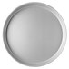 A close-up of a round silver pan with a white background.