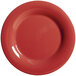 A close-up of a cranberry red GET Diamond Harvest wide rim plate.