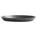 A close-up of a Vollrath 9" perforated heavy weight aluminum pizza pan.