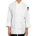 A person wearing a white Uncommon Chef long sleeve chef coat.