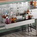 A 30-inch stainless steel double tier speed rail designed for holding liquor bottles behind a bar.