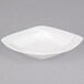 A CAC Garden State white square porcelain bowl with a wavy design.