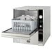 A Jet Tech F-14 countertop warewasher with a basket of dishes.
