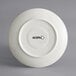 A white Acopa stoneware saucer with black text reading "Keystone" and "Vanilla Bean" on it.