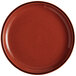 a red plate with speckled specks