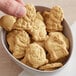 A bowl of KEEBLER animal crackers with animal shapes on them.