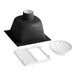 A black and white cast iron floor sink with a drain and a white plastic drain cover.