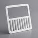 a white plastic frame with holes