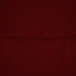 A close up of a burgundy fabric table cover.