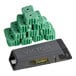 A refillable mouse bait station with a stack of green bait blocks.