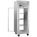 A Traulsen pass-through refrigerator with open glass doors on the right.