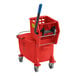 A red Lavex mop bucket with a handle and side press wringer.