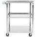 A Vollrath stainless steel utility cart with three shelves and wheels.