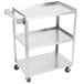 A silver stainless steel Vollrath utility cart with three shelves and wheels.