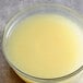A bowl of Les Vergers Boiron lemon puree on a table.