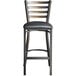 A Lancaster Table & Seating distressed copper metal ladder back bar stool with a black vinyl cushion.