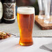 a glass of beer on a table