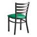 A Lancaster Table & Seating distressed copper metal restaurant chair with a green vinyl padded seat.