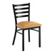 A ladder back chair with a distressed copper finish and a light brown vinyl padded seat.