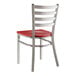 A Lancaster Table & Seating clear coat finish metal ladder back chair with a mahogany wood seat.
