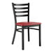 A Lancaster Table & Seating black metal ladder back chair with a mahogany wood seat.
