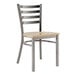 A Lancaster Table & Seating metal ladder back chair with a driftwood seat.