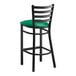 A Lancaster Table & Seating black ladder back bar stool with a green vinyl padded seat.