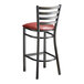 A Lancaster Table & Seating distressed copper metal bar stool with a burgundy vinyl padded seat.