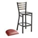 A Lancaster Table & Seating distressed copper metal bar stool with a round ladder back and a burgundy vinyl cushion.