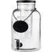 a glass jar with a black label