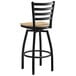 A Lancaster Table & Seating black ladder back bar stool with a natural wood seat.